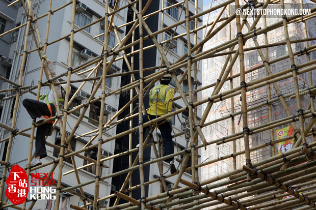 Workers Working on Bamboo Scaffolding